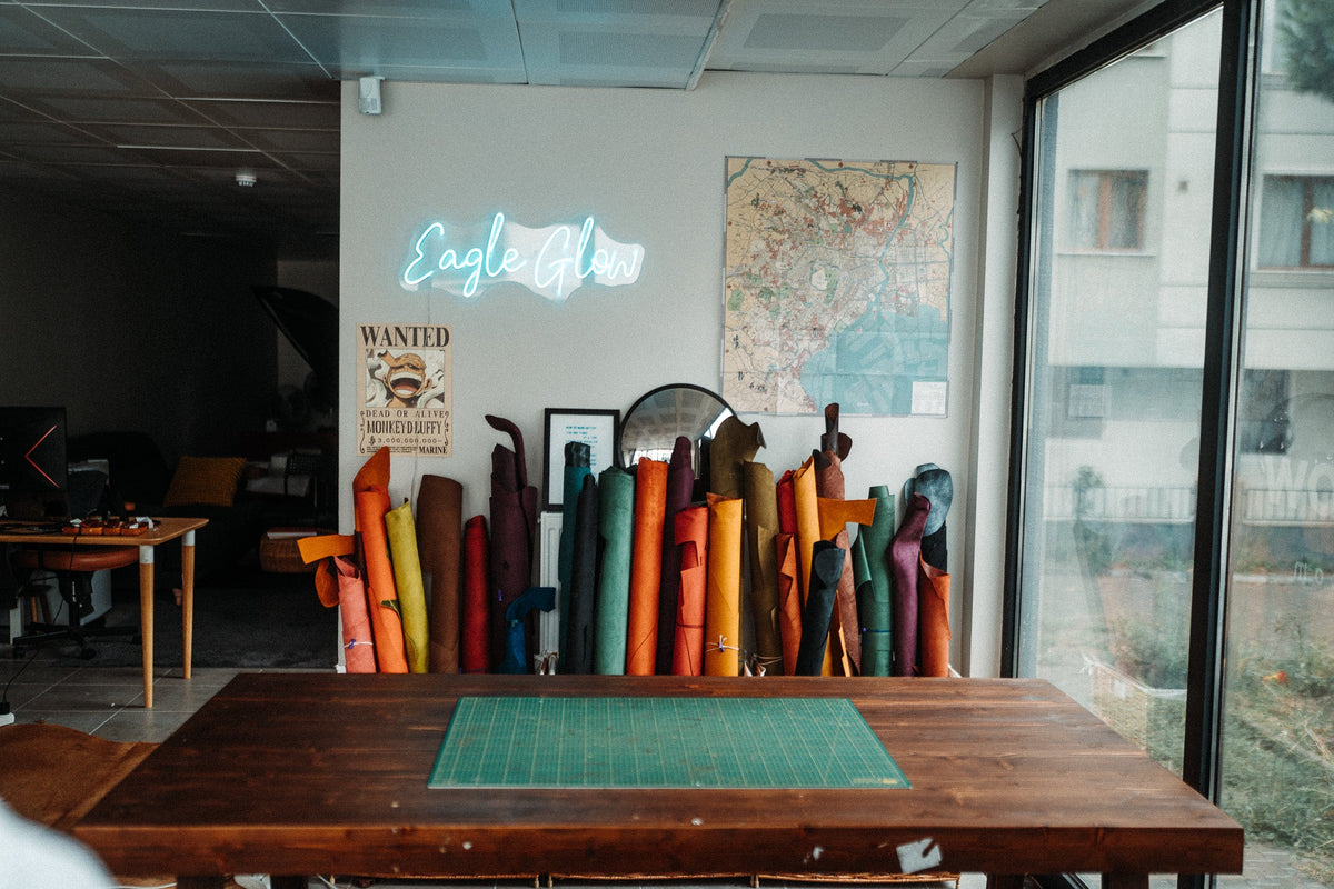 Leather rolls under the Eagle Glow neon sign